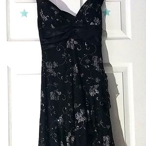 Its a black dress with silver glittery designs